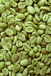 Photo of Many green coffee beans as background, top view