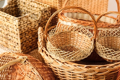 Many different wicker baskets made of natural material as background