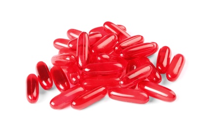Photo of Pile of red pills on white background