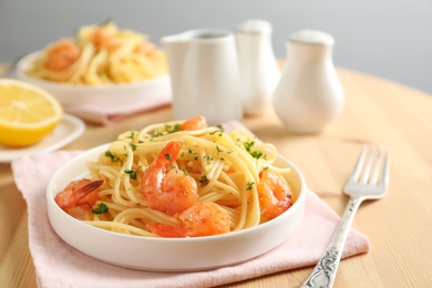 Photo of Delicious pasta with shrimps on plate