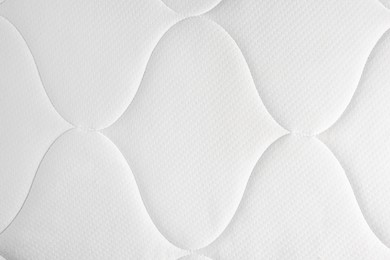 Clean white mattress as background, top view. After use of fabric shaver