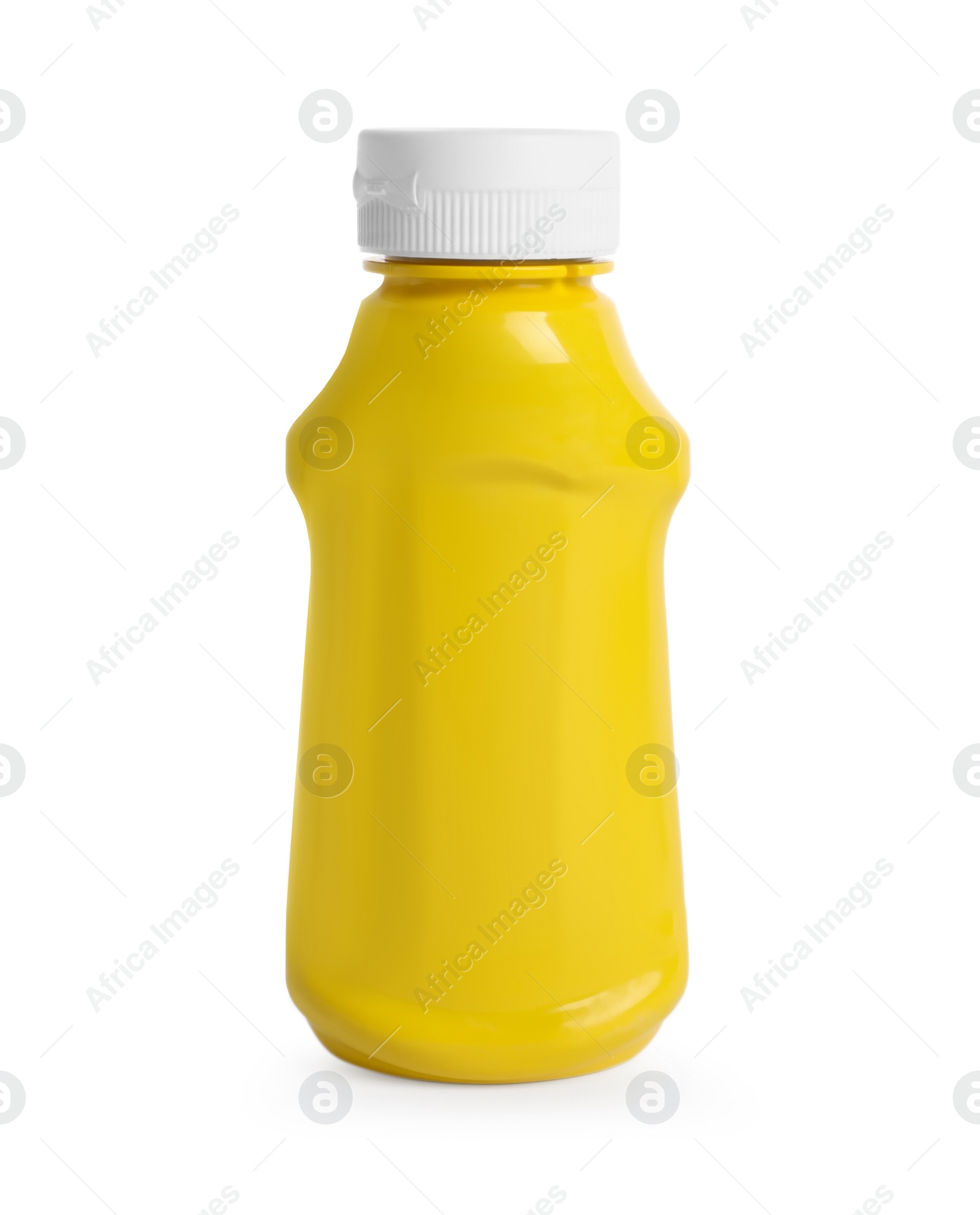 Photo of Spicy mustard in plastic bottle isolated on white