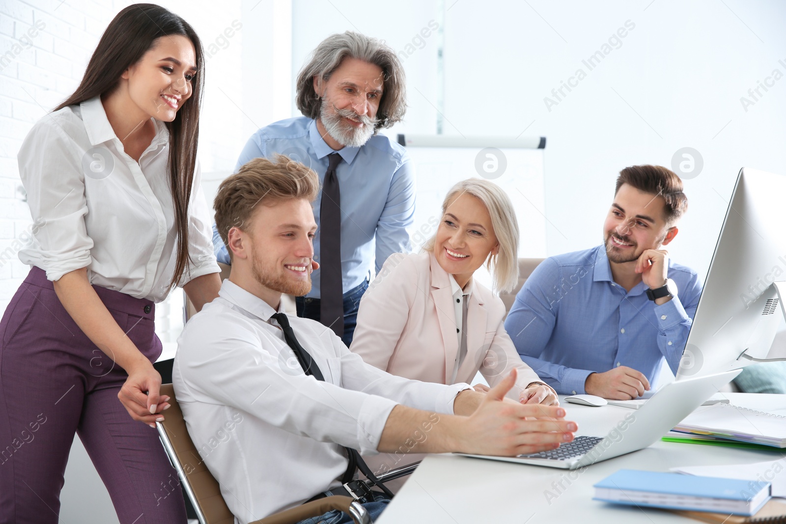 Photo of Business people discussing work matters at table in office. Professional communication