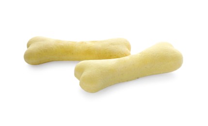 Photo of Bone shaped dog cookies on white background