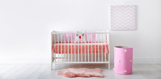Image of Baby room interior with comfortable crib. Banner design