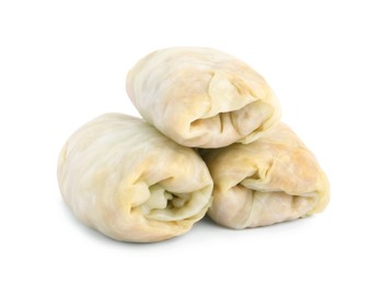 Photo of Uncooked stuffed cabbage rolls on white background