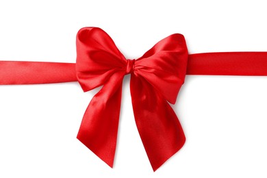 Photo of Red bow and ribbon on white background, top view