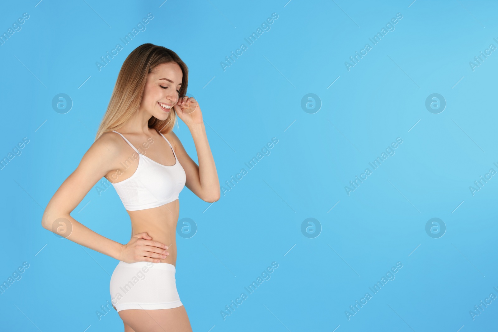 Photo of Young slim woman on color background, space for text. Perfect body