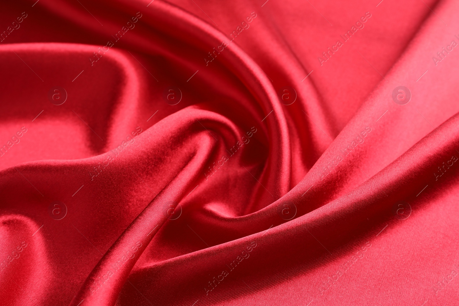 Photo of Texture of beautiful red silk fabric as background, closeup