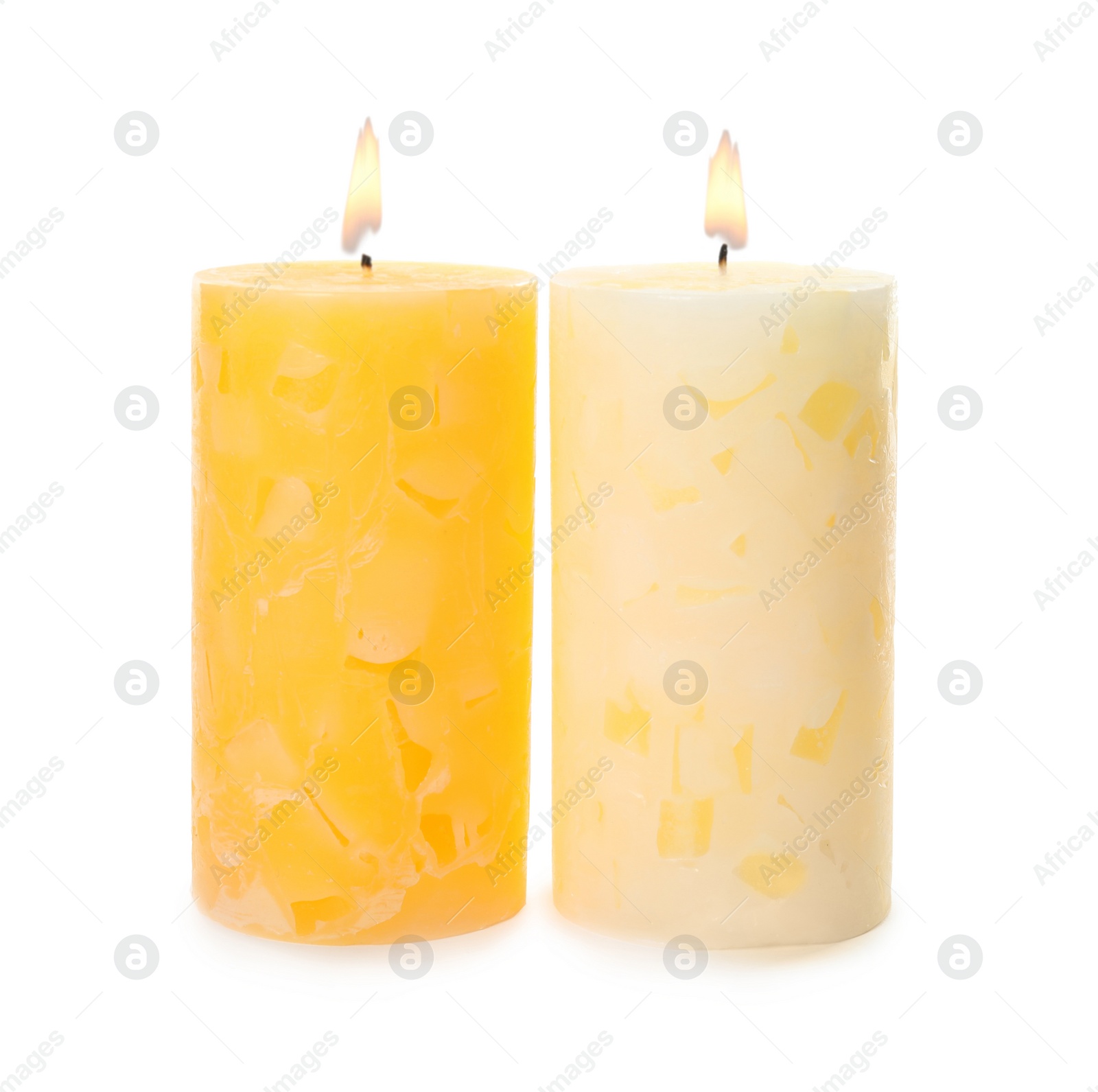 Photo of Alight color wax candles on white background