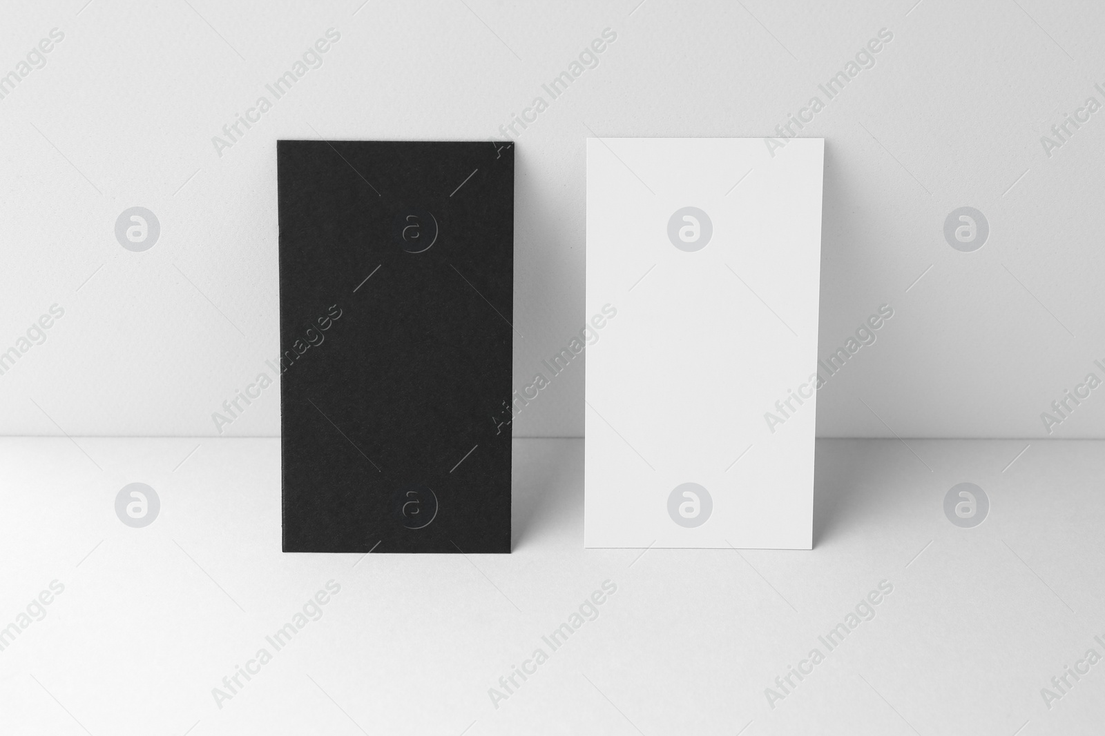 Photo of Blank business cards on white background. Mockup for design