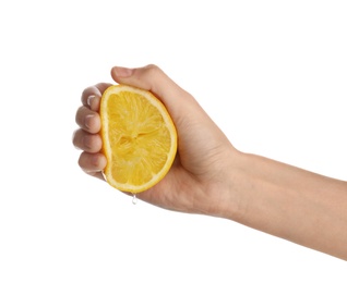 Photo of Woman squeezing fresh lemon juice isolated on white, closeup