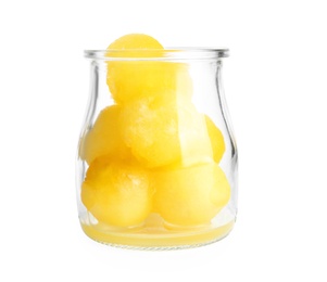 Photo of Glass jar of melon balls on white background