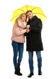 Full length portrait of beautiful couple with umbrella, isolated on white