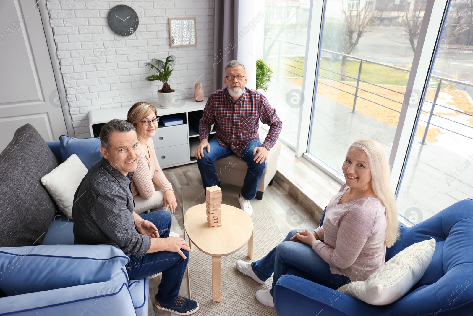 Photo of Happy senior couples spending time together at home