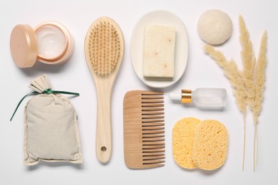 Bath accessories. Different personal care products and dry spikelets on white background, flat lay