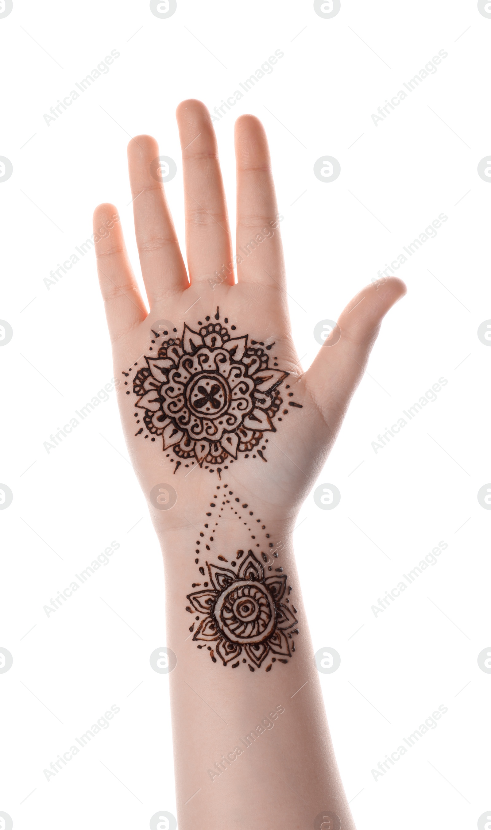 Photo of Little girl with henna tattoo on palm against white background, closeup. Traditional mehndi ornament