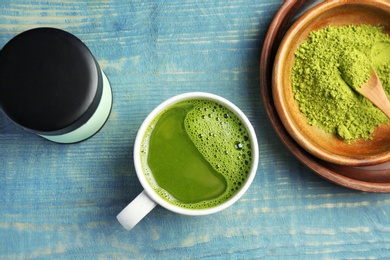 Photo of Flat lay composition with matcha tea on wooden background