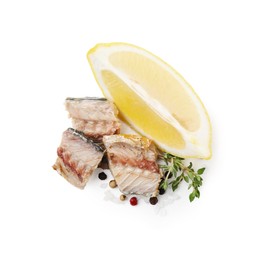 Photo of Delicious canned mackerel chunks with thyme, lemon and spices on white background, top view