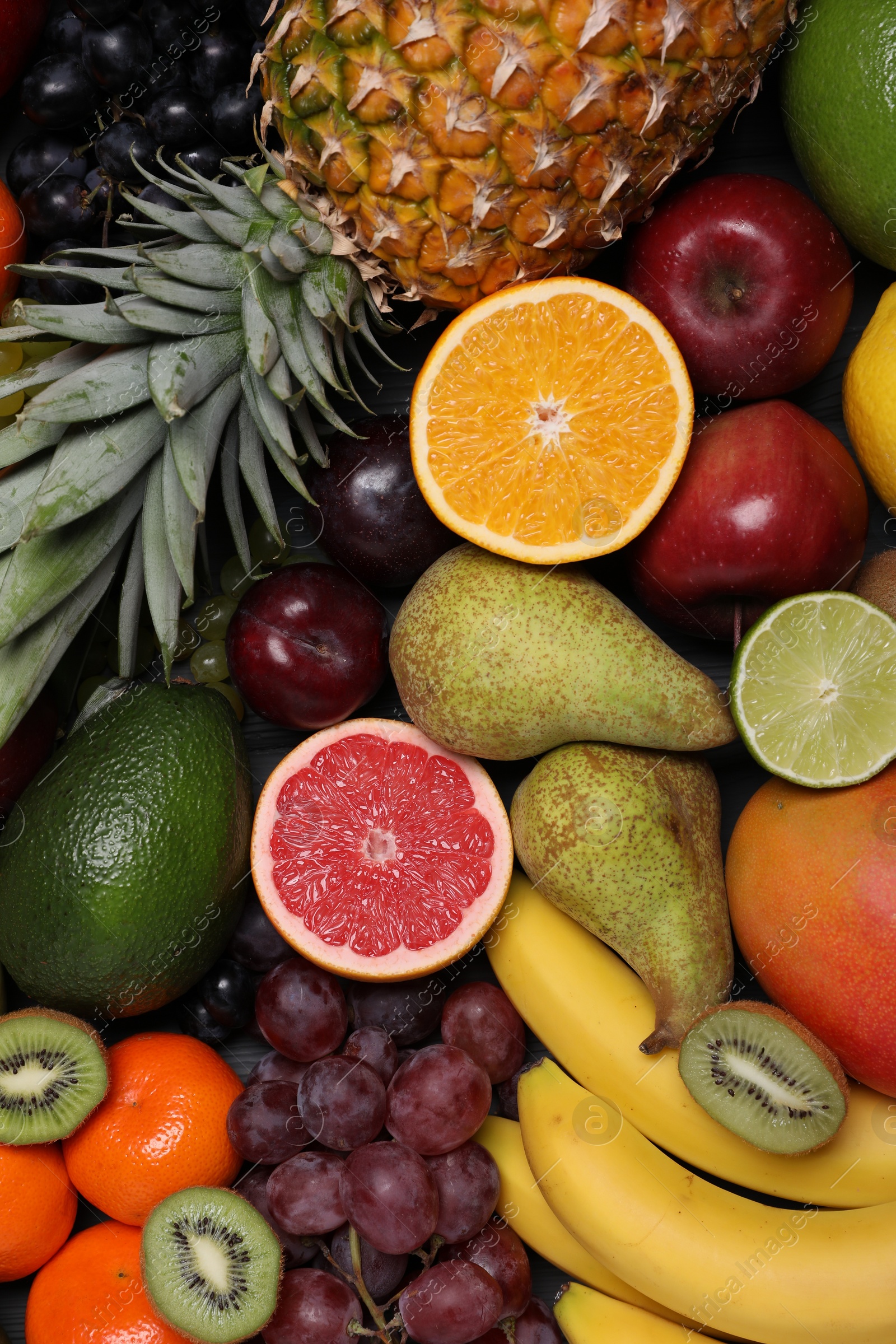 Photo of Different ripe fruits as background, top view