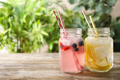 Natural lemonades in mason jars on wooden table