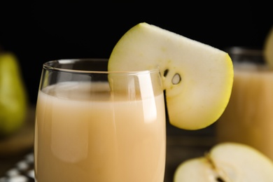 Fresh juice with slice of pear, closeup