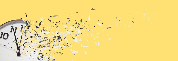 Image of Flow of time. Analog clock dissolving on yellow background, space for text. Banner design