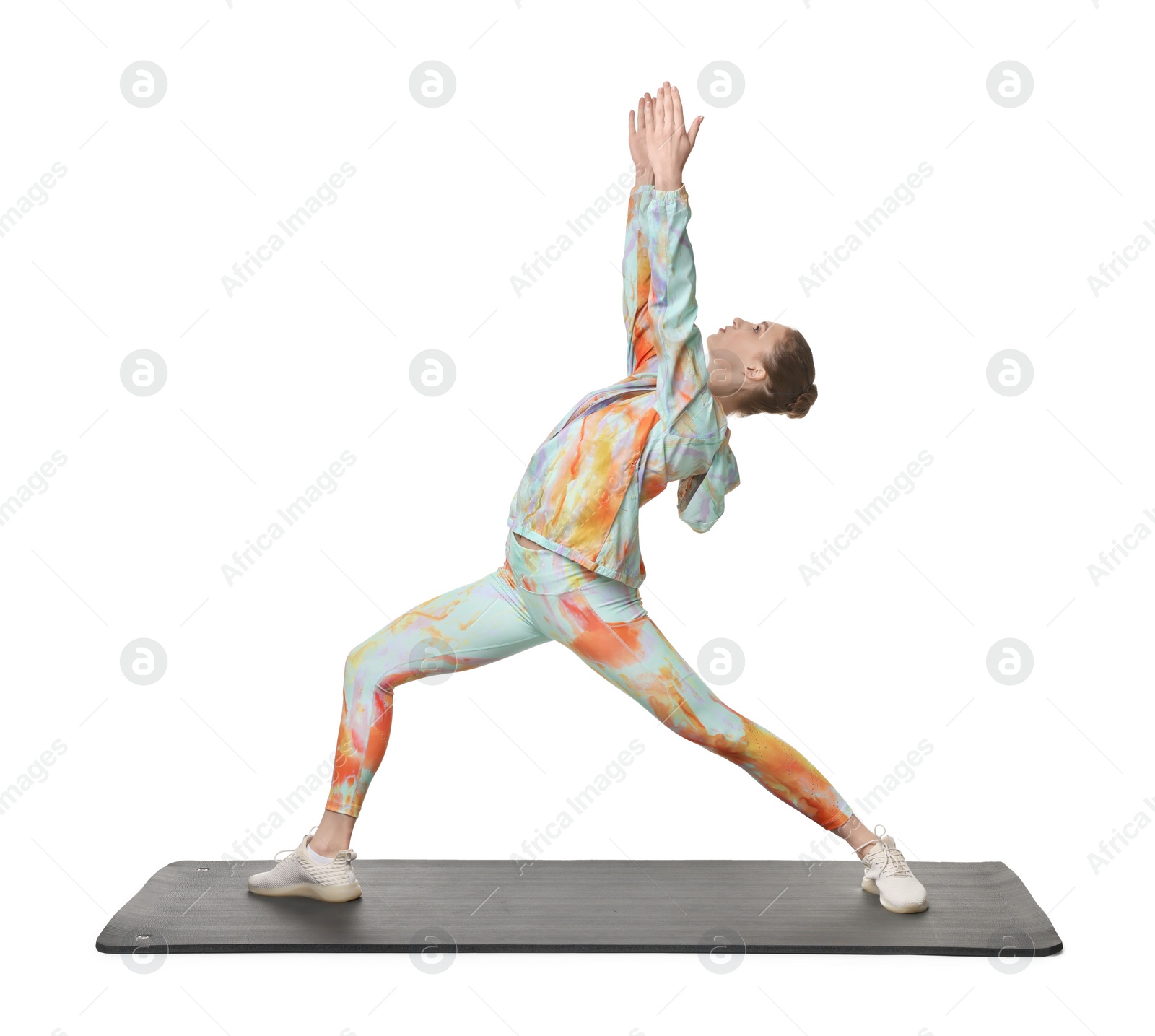 Photo of Young woman practicing yoga on white background