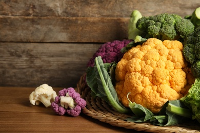 Photo of Different fresh cabbages on table. Healthy food