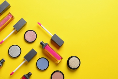 Composition with lipsticks on color background, flat lay. Space for text