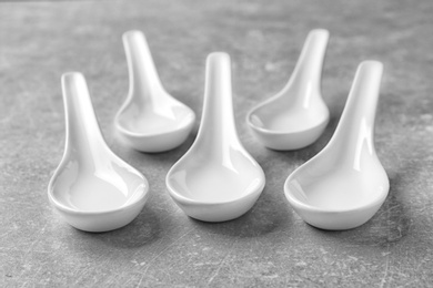 Photo of Clean Miso soup spoons on grey background