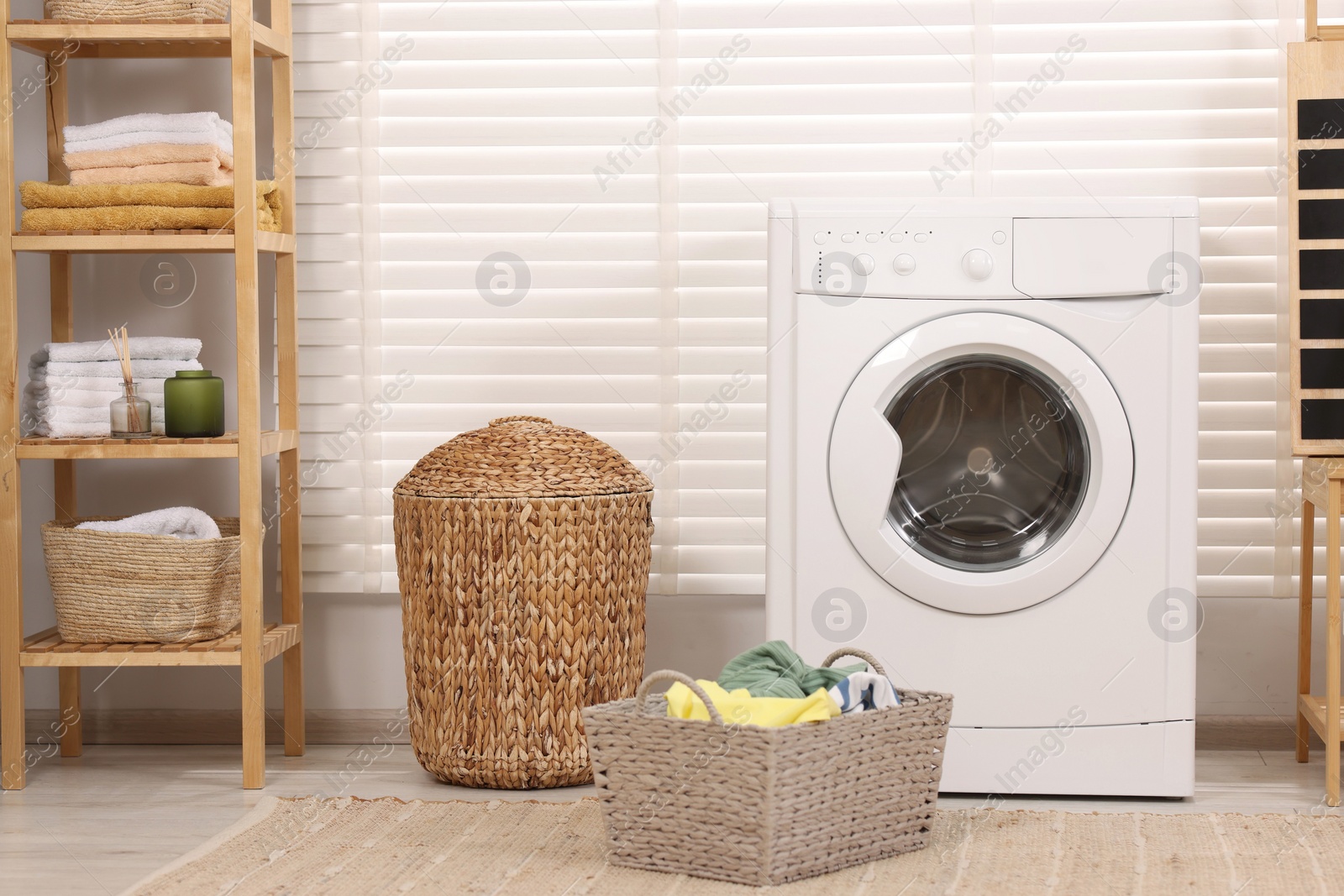 Photo of Laundry room interior with washing machine and baskets