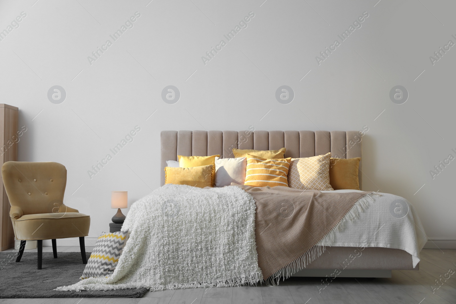 Photo of Stylish interior of contemporary room with comfortable bed