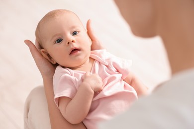 Mother with her cute little baby at home