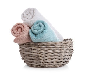 Photo of Wicker basket with clean towels isolated on white