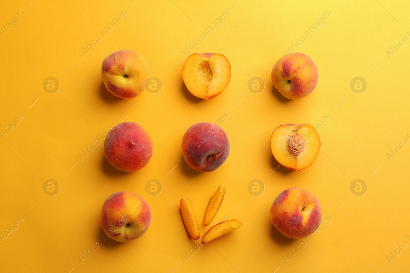 Photo of Flat lay composition with fresh peaches on yellow background