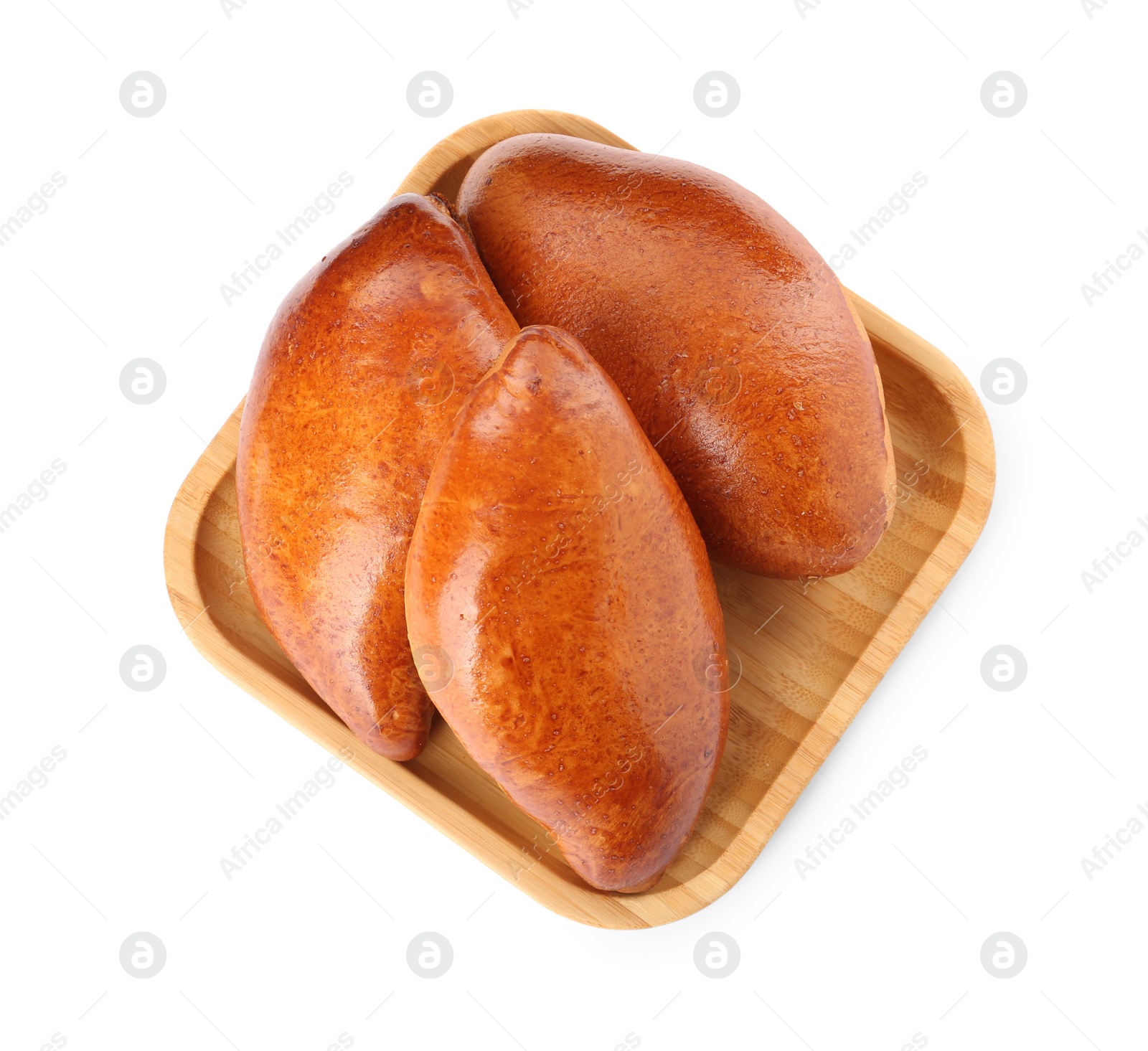 Photo of Wooden tray with delicious baked patties on white background