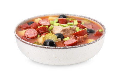 Photo of Meat solyanka soup with thin dry smoked sausages in bowl isolated on white