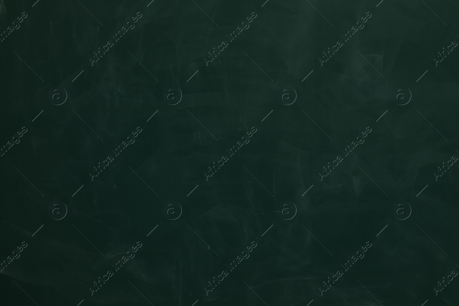 Photo of Chalk rubbed out on green chalkboard as background, closeup. Space for text