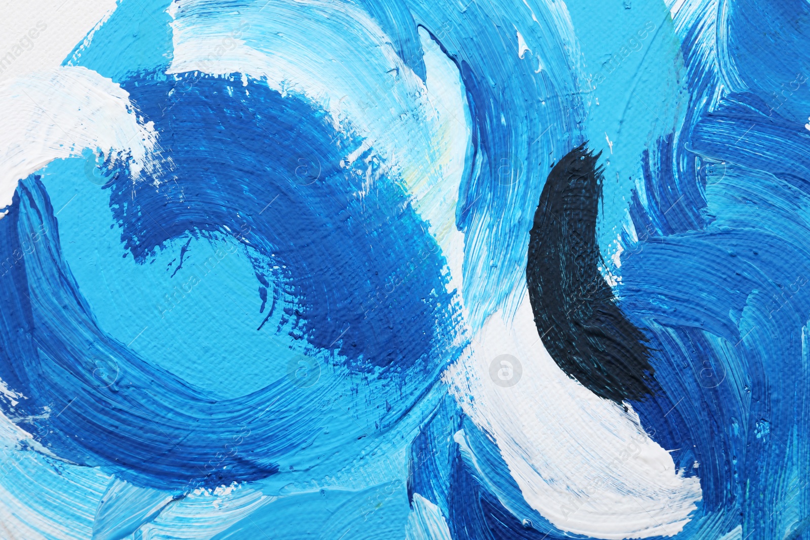 Photo of Beautiful strokes of blue oil paints on white canvas as background, closeup