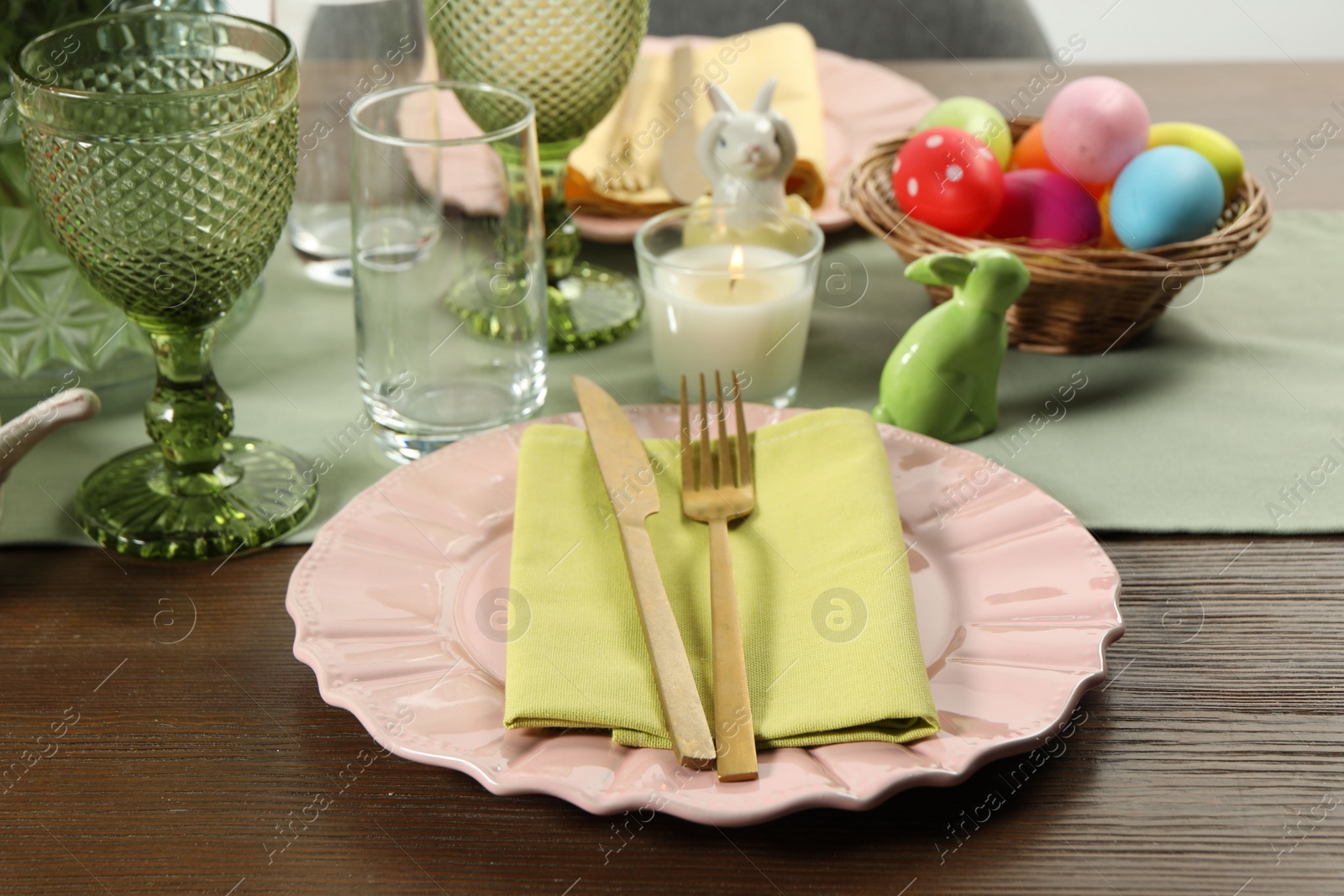 Photo of Easter celebration. Festive table setting with painted eggs.