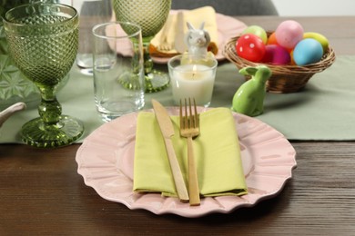 Photo of Easter celebration. Festive table setting with painted eggs.