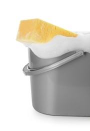 Photo of Plastic bucket with foam and sponge isolated on white. Cleaning supplies