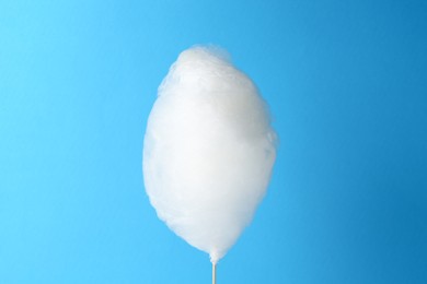 One sweet cotton candy on light blue background