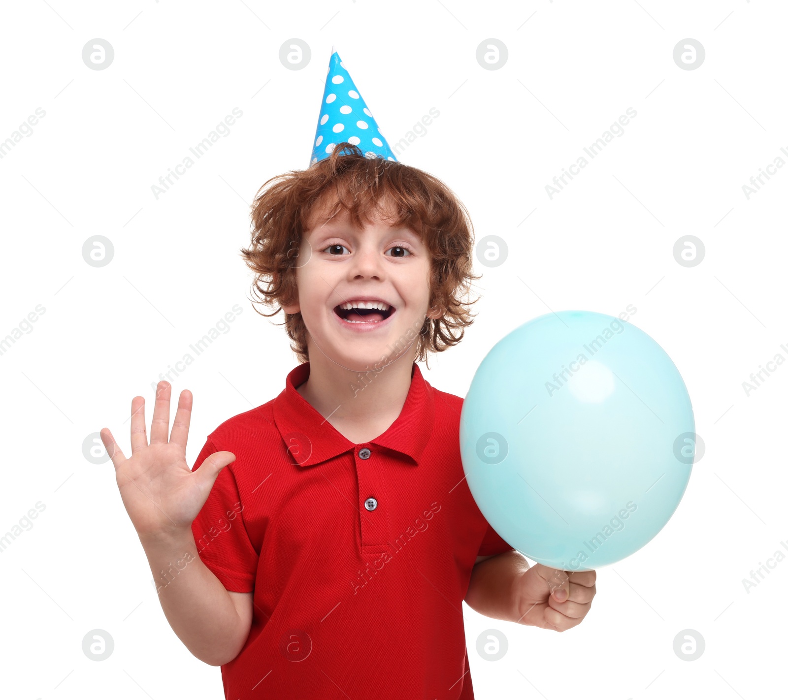 Photo of Happy little boy in party hat with balloon on white background