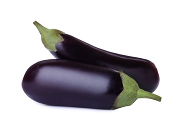 Photo of Tasty raw ripe eggplants isolated on white