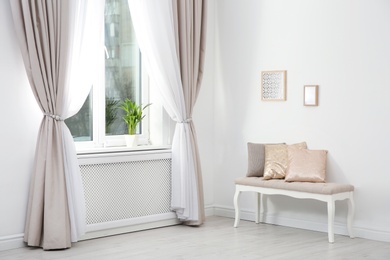 Photo of Modern window with curtains in room. Home interior