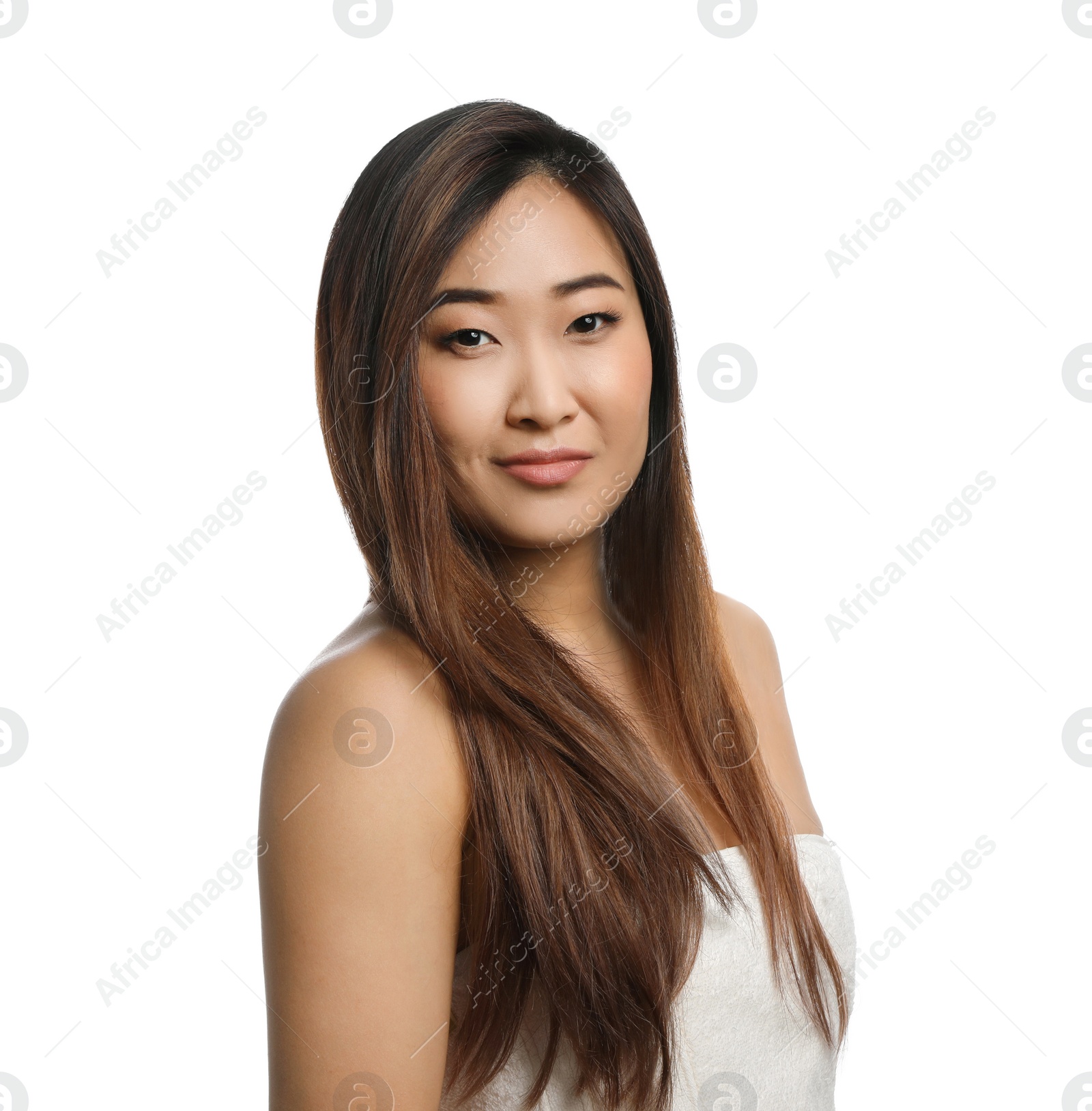 Photo of Portrait of beautiful Asian woman wrapped in towel isolated on white. Spa treatment