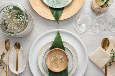 Photo of Elegant festive setting on white wooden table, flat lay