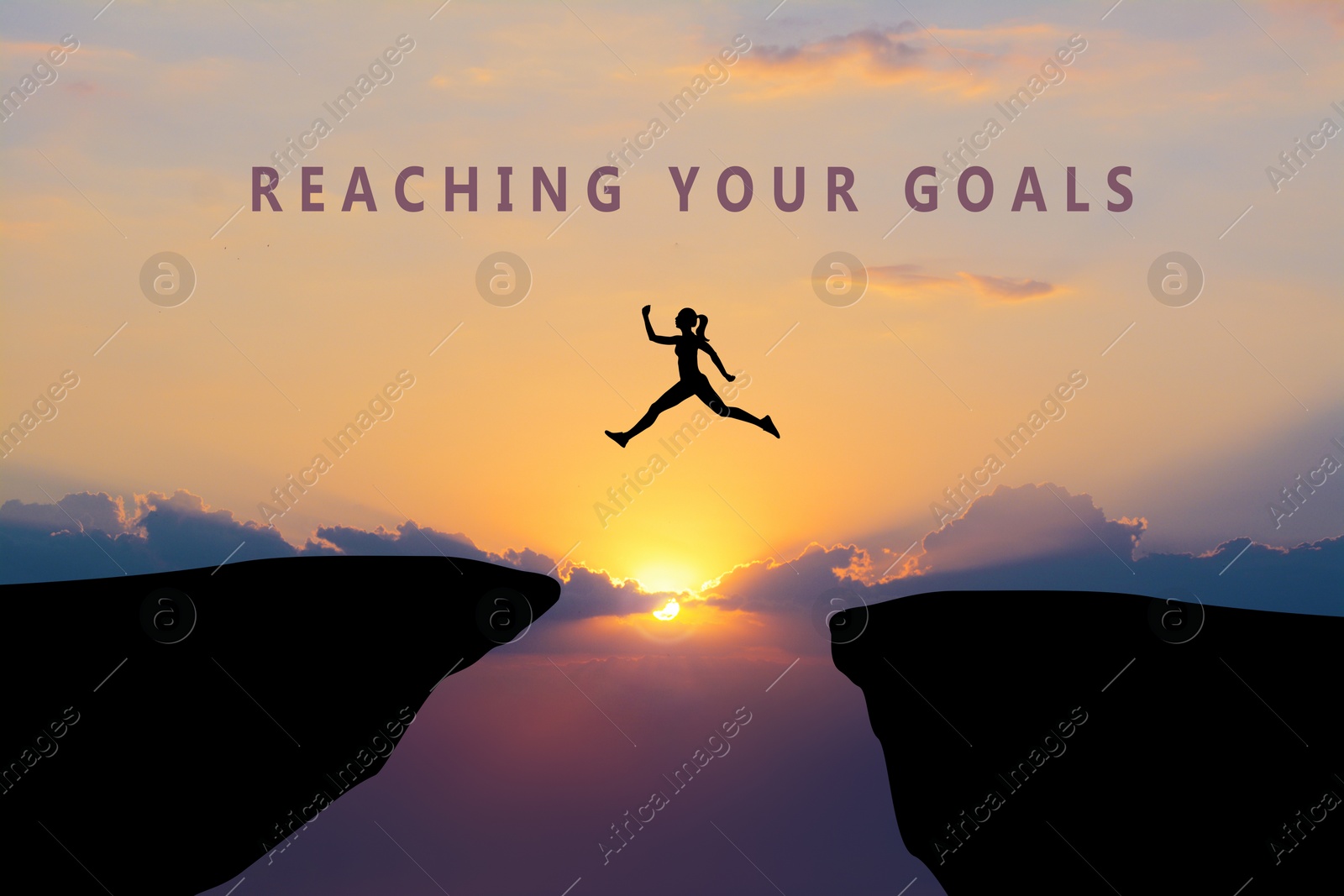 Image of Concept of reaching life and business goals. Silhouette of woman jumping over chasm at sunrise